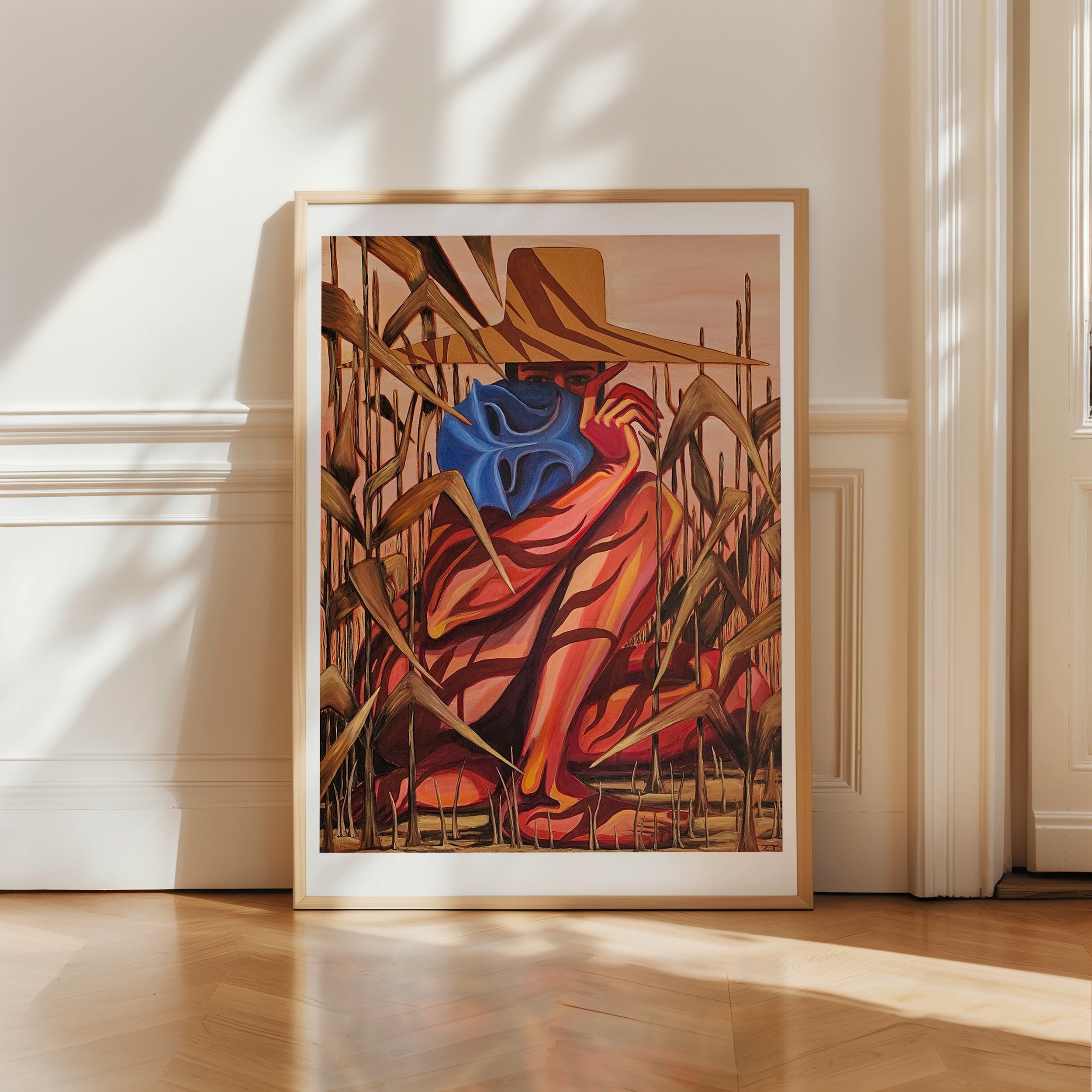 Framed abstract artwork on a wall with sunlight casting shadows