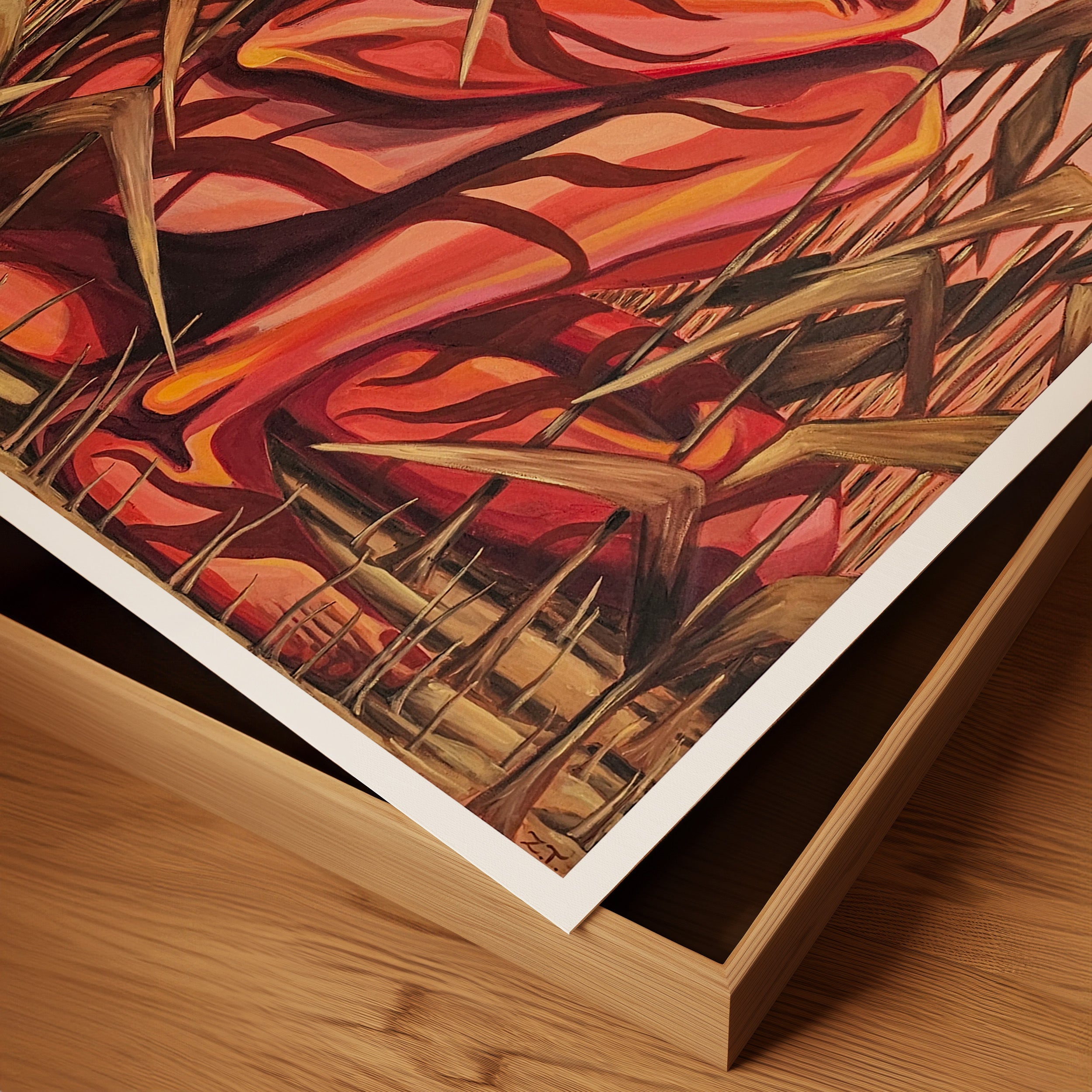 Abstract artwork with warm colors on a wooden surface