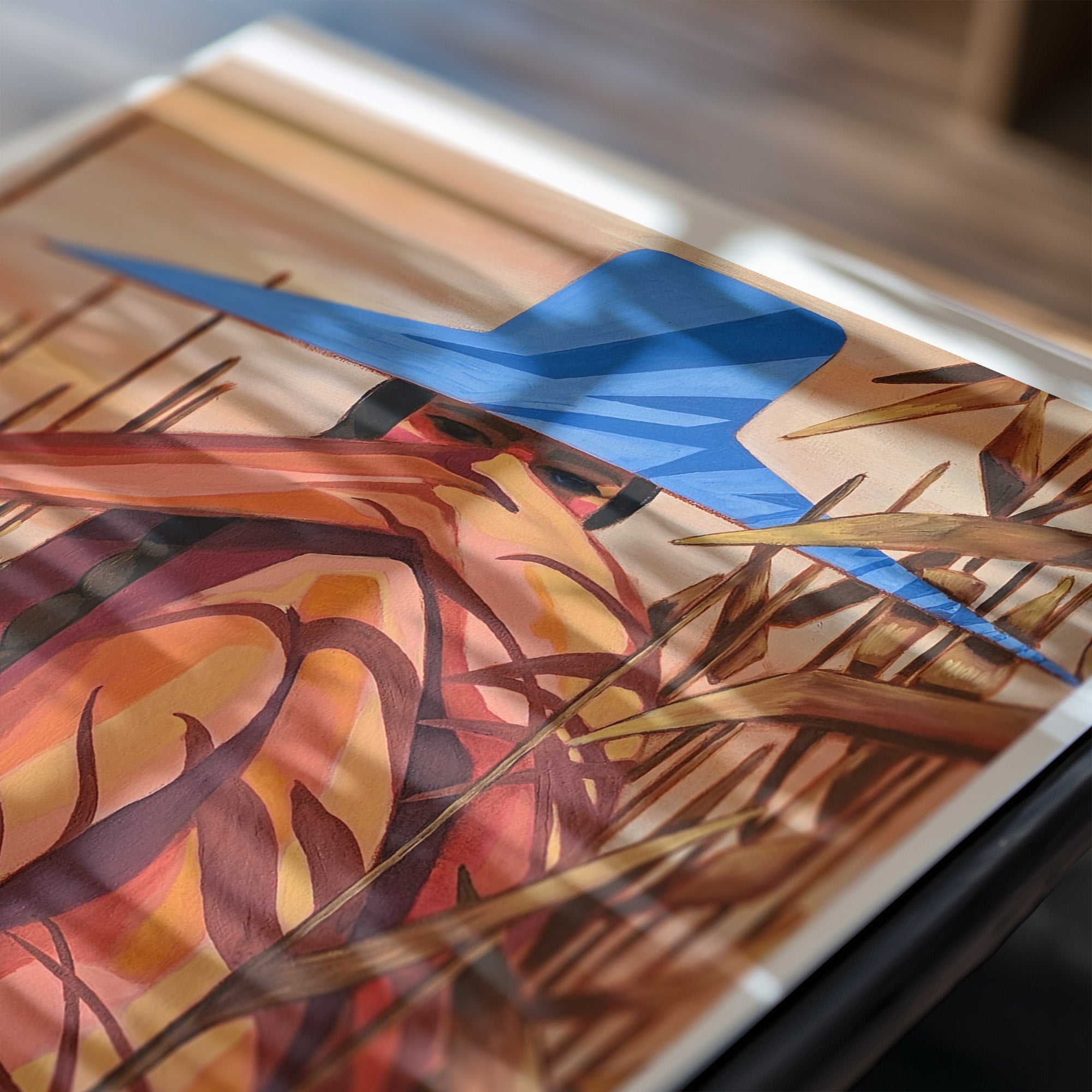 Close-up of a colorful abstract painting with blue, red, and brown hues.